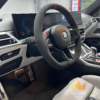 BMW M4 Competition steering wheel and cockpit